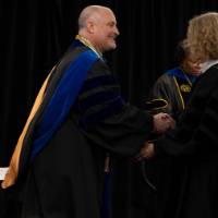 More faculty shaking hands
